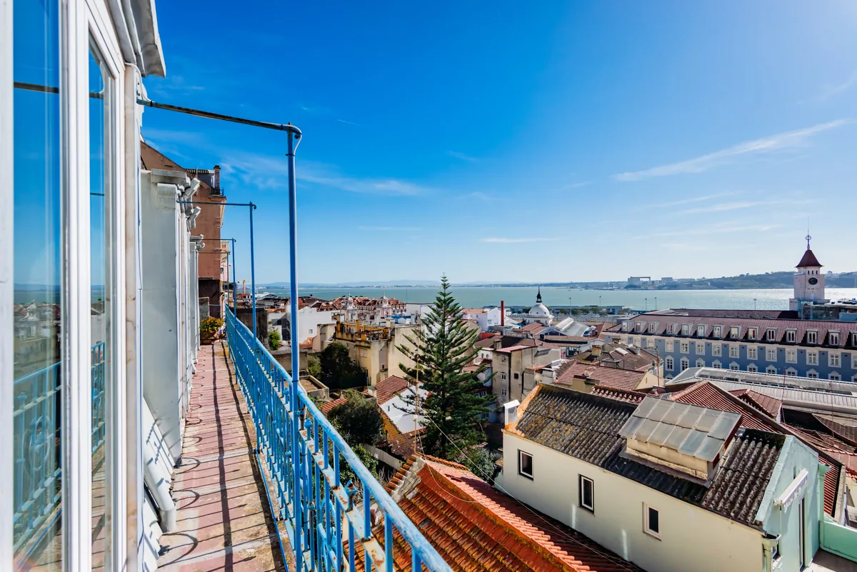 View over the River Tagus and the rooftops of Lisbon from the balcony of a short-term rental